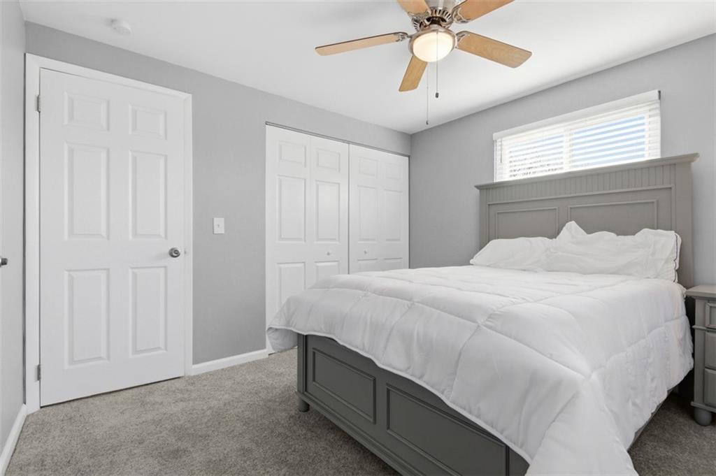 3106 Greenfield Road Glenshaw, PA 15116 - Photo 31 of 47 a bedroom with a bed and a ceiling fan