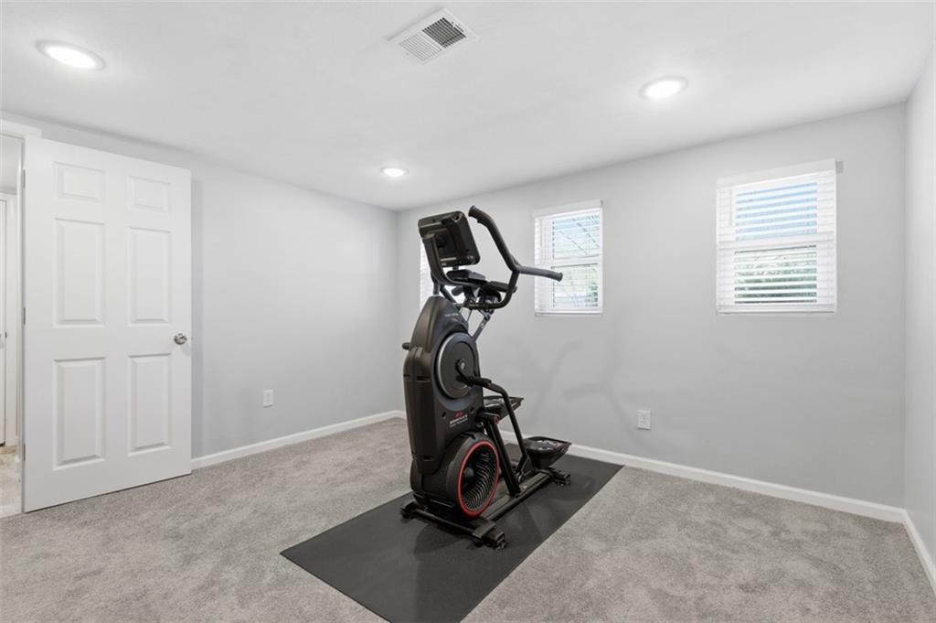 3106 Greenfield Road Glenshaw, PA 15116 - Photo 35 of 47 a room with gym equipment and windows