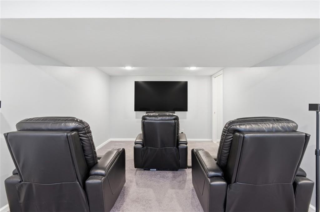 3106 Greenfield Road Glenshaw, PA 15116 - Photo 36 of 47 a living room with furniture and a flat screen tv