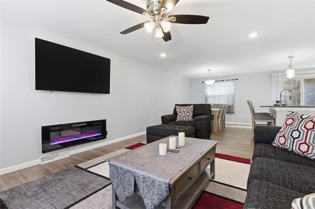 3106 Greenfield Road Glenshaw, PA 15116 - Photo 9 of 47 a living room with furniture and a flat screen tv