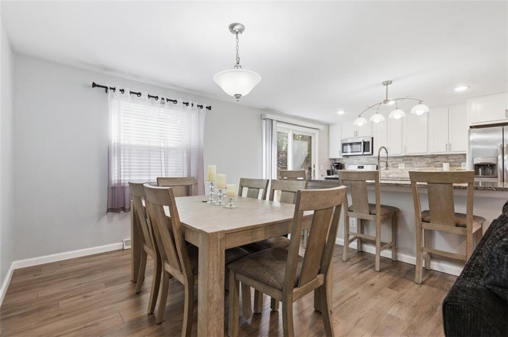 3106 Greenfield Road Glenshaw, PA 15116 - Photo 10 of 47 a view of a dining room with furniture and wooden floor