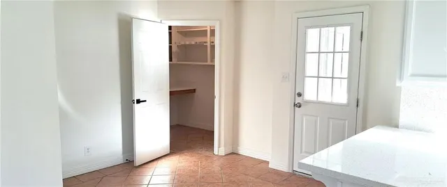 a view of storage and utility room with wooden floor