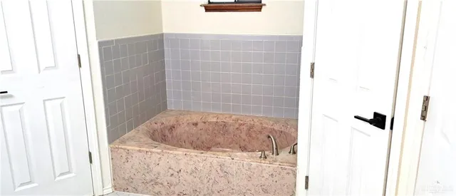 a view of swimming pool with a patio