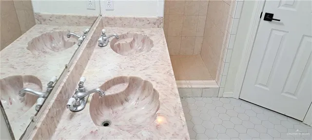 a view of a backyard with table and chairs and a large tree