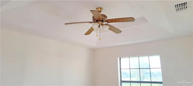 a kitchen with stainless steel appliances granite countertop white cabinets and window