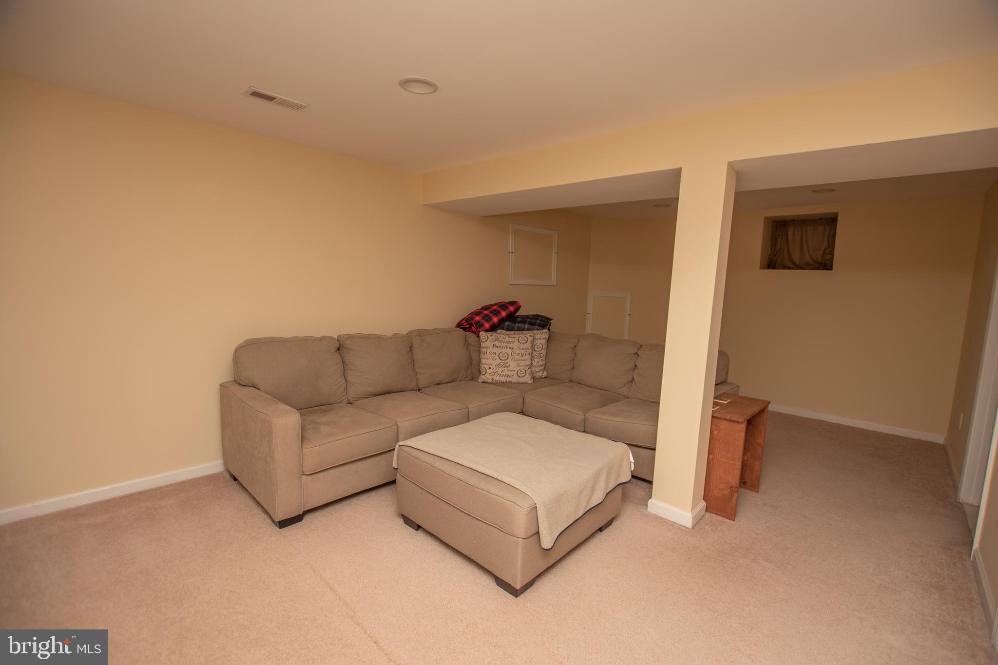 67 Edmondson Ridge Road Baltimore, MD 21228 - Photo 17 of 41 a living room with furniture and a couch