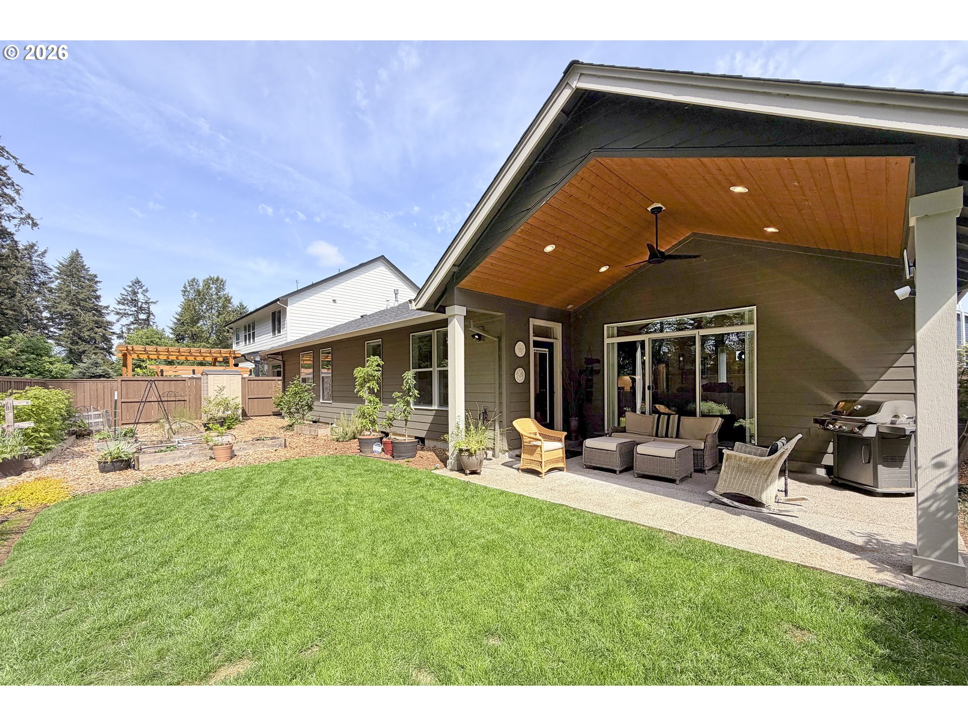 1927 South Fir Loop Canby, OR 97013 - Photo 28 of 35 a backyard of a house with table and chairs
