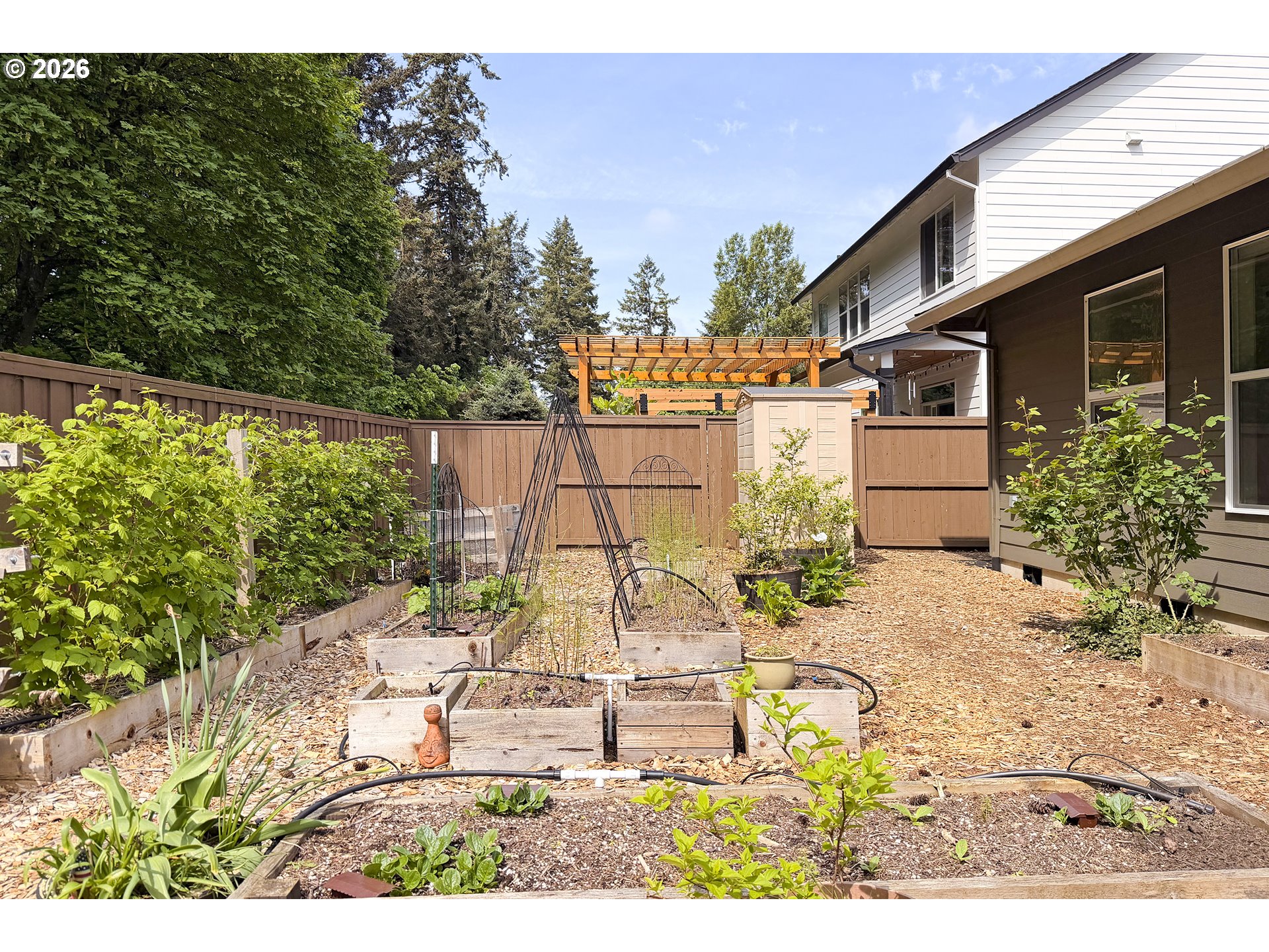 1927 South Fir Loop Canby, OR 97013 - Photo 31 of 35 a view of a patio with table and chairs and potted plants