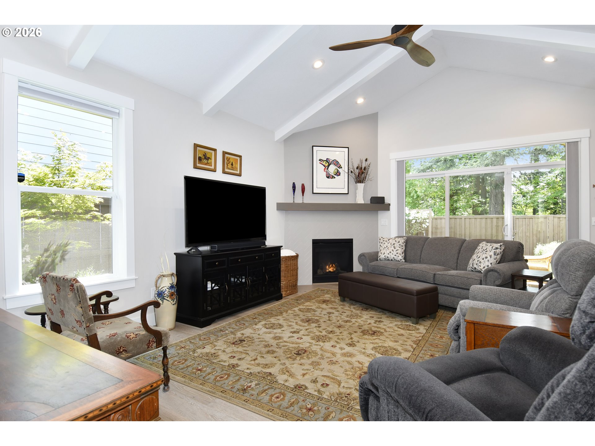 1927 South Fir Loop Canby, OR 97013 - Photo 5 of 35 a living room with furniture a flat screen tv and a fireplace
