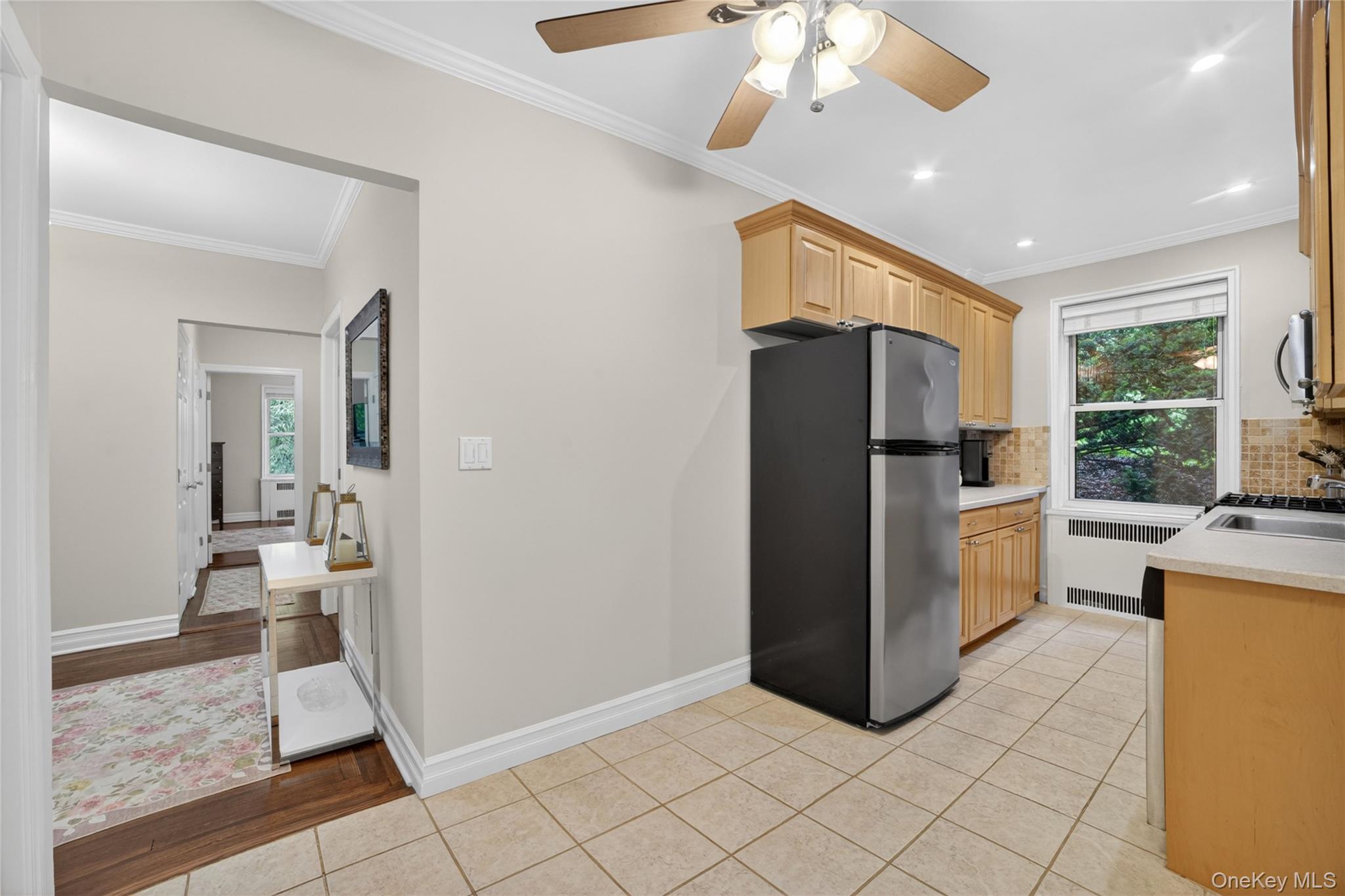 824 Palmer Road, Unit 1F Bronxville, NY 10708 - Photo 8 of 26 a kitchen with a refrigerator and a stove top oven