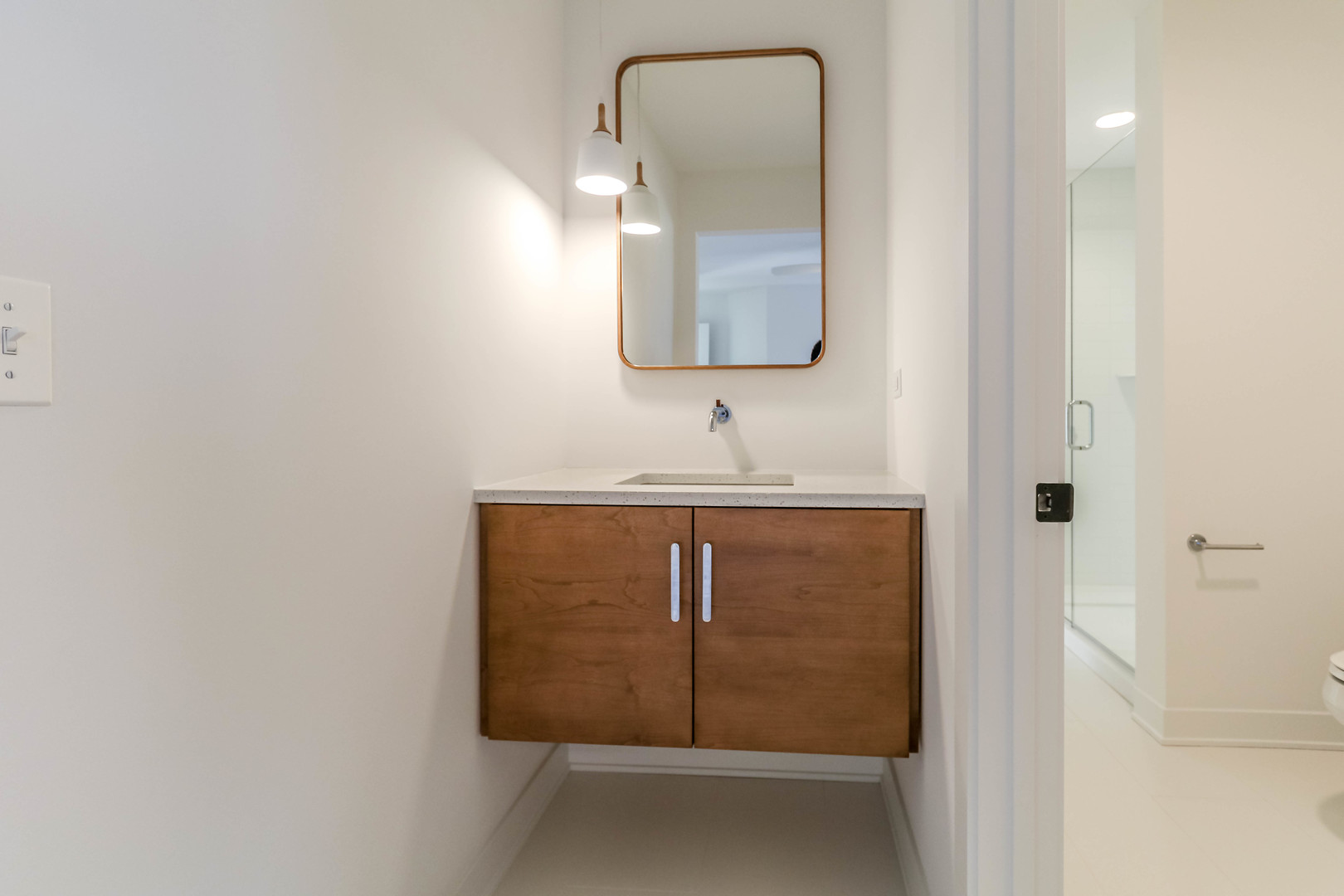 27-w151 48th Street Naperville, IL 60563 - Photo 22 of 25 a bathroom with a sink and a mirror