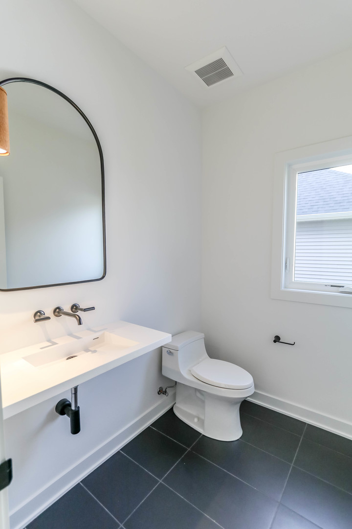 27-w151 48th Street Naperville, IL 60563 - Photo 25 of 25 a bathroom with a toilet sink and mirror