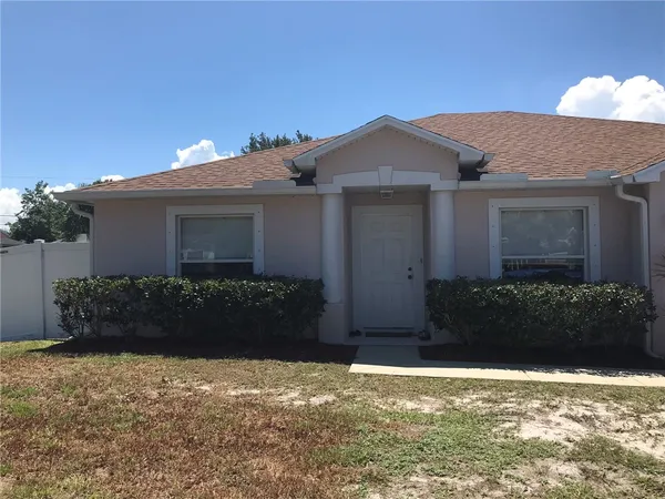 front view of a house with a yard