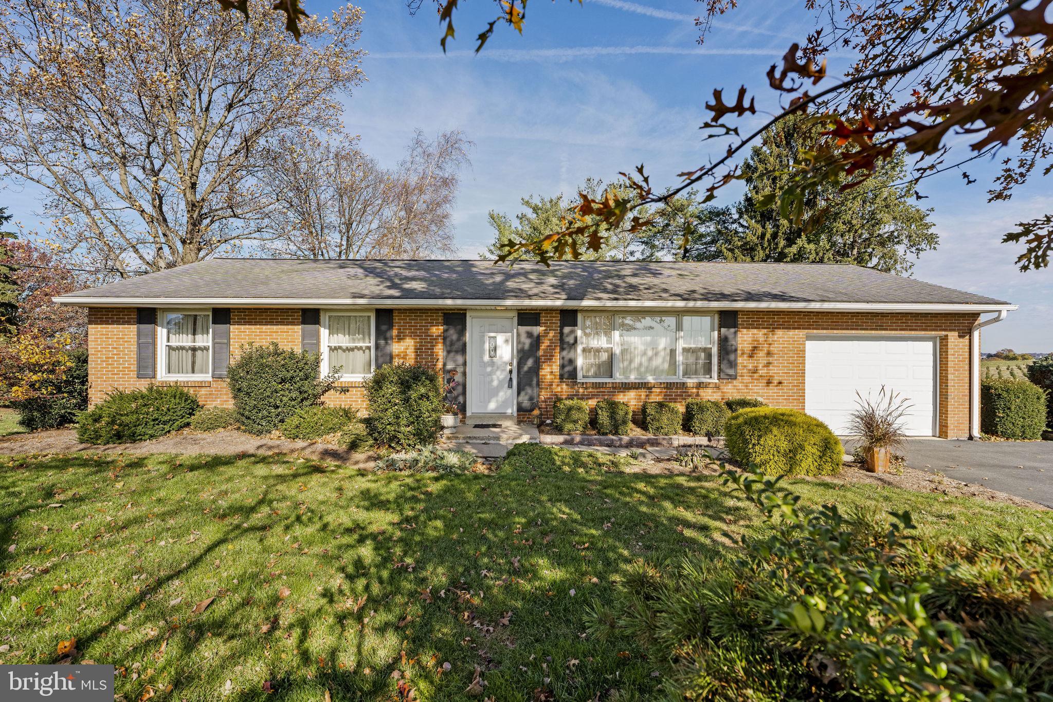 a house with trees in front of it