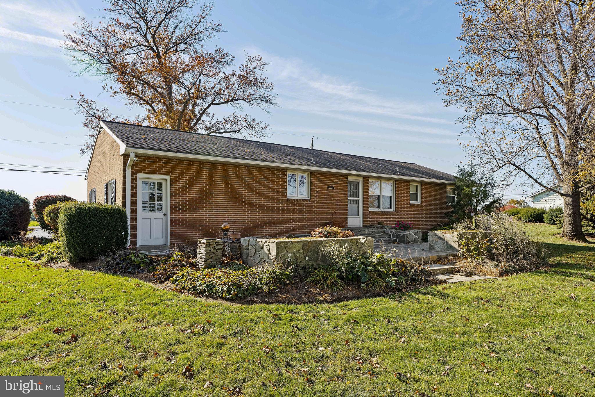 337 Long Road Manheim, PA 17545 - Photo 40 of 50 a front view of a house with yard and seating area