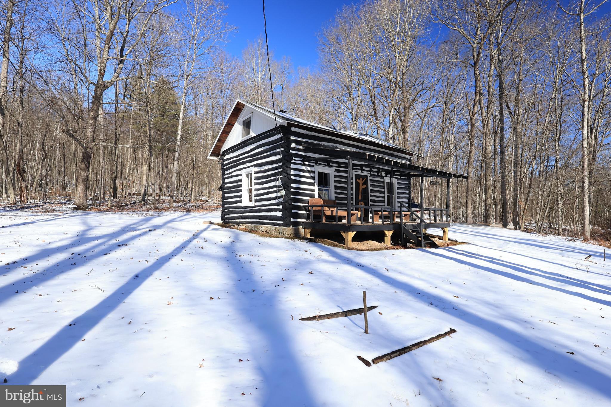 4464 Tram Road Spruce Creek, PA 16683 - Photo 49 of 53 a backyard of a house with wooden fence