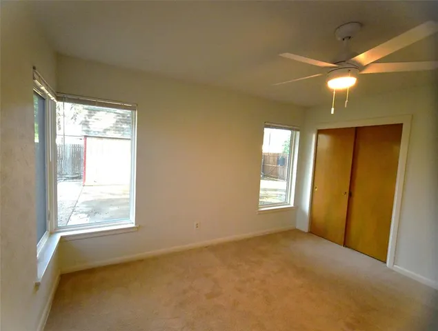 a view of an empty room with a bathroom