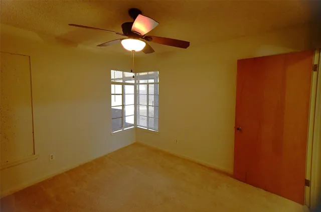 a kitchen with stainless steel appliances granite countertop a sink a stove and refrigerator