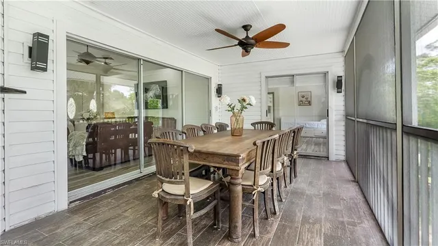 a view of a dining room with furniture and window