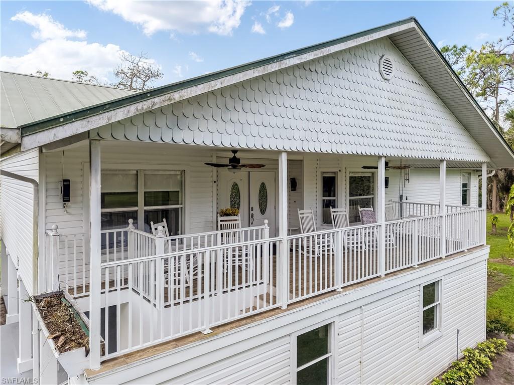 2920 24th Avenue Southeast Naples, FL 34117 - Photo 2 of 50 a view of a house with a deck