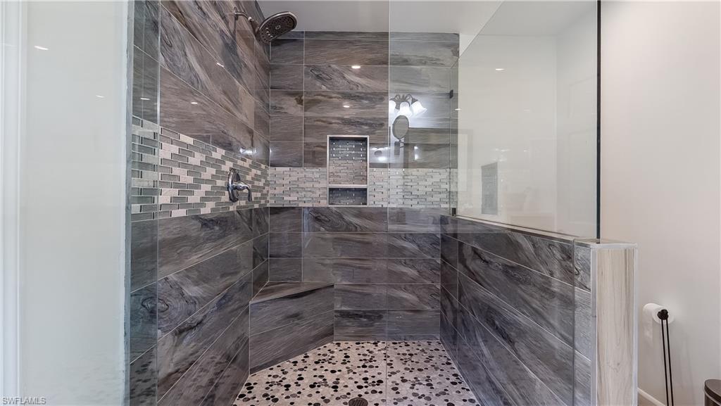 2920 24th Avenue Southeast Naples, FL 34117 - Photo 23 of 50 a bathroom with a shower