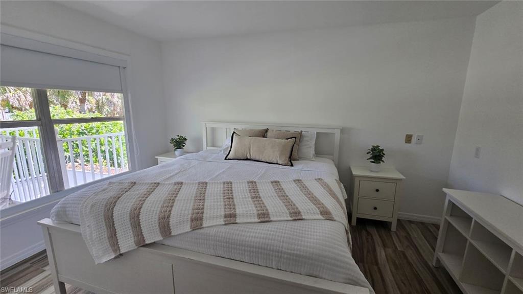 2920 24th Avenue Southeast Naples, FL 34117 - Photo 24 of 50 a bedroom with a bed and a window