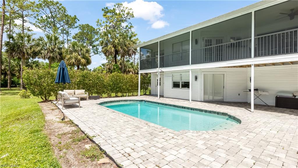2920 24th Avenue Southeast Naples, FL 34117 - Photo 27 of 50 a view of a house with a swimming pool