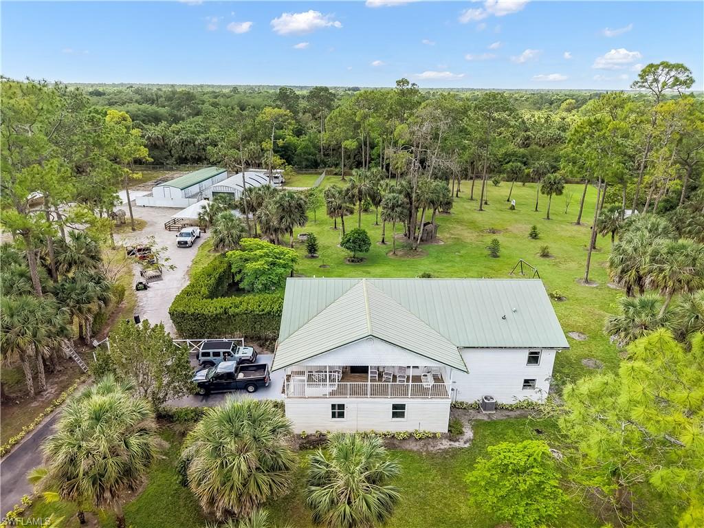 2920 24th Avenue Southeast Naples, FL 34117 - Photo 31 of 50 an aerial view of a house with yard swimming pool and outdoor seating