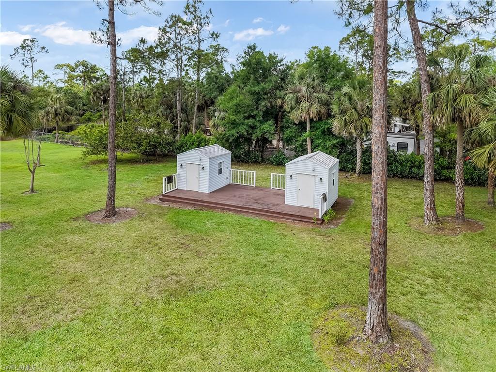 2920 24th Avenue Southeast Naples, FL 34117 - Photo 32 of 50 a garden view with a sitting space