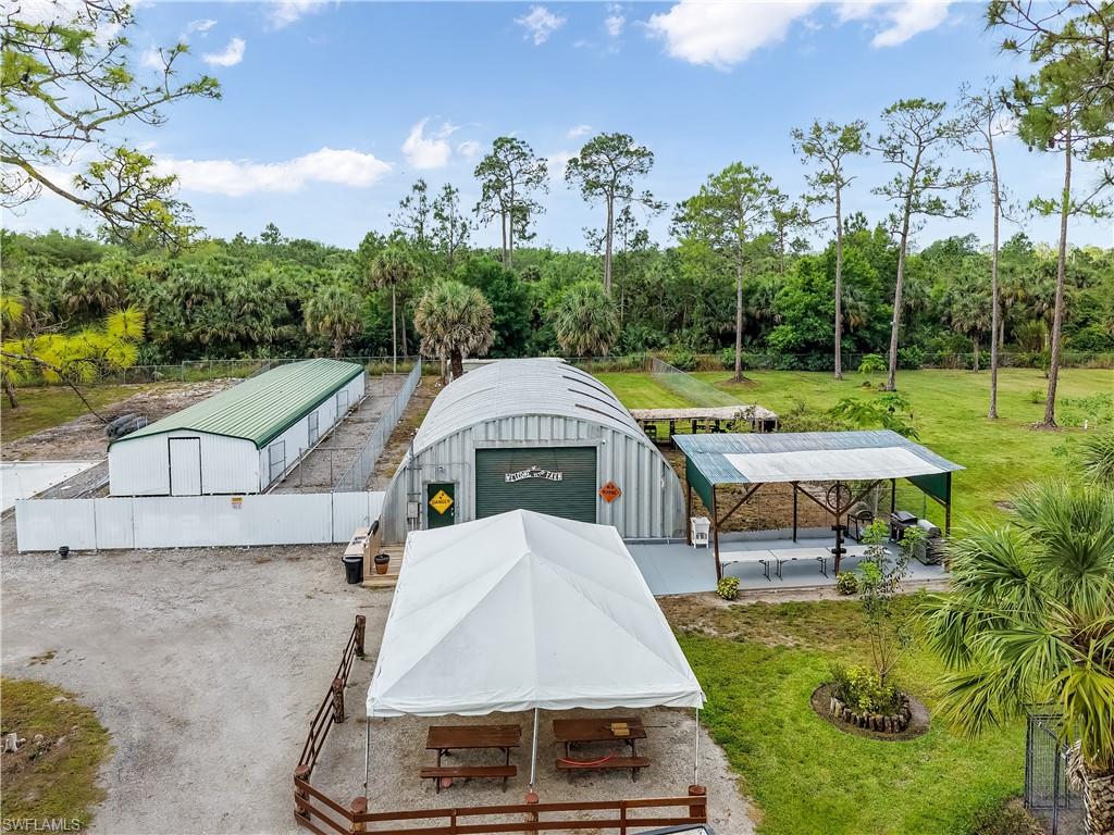 2920 24th Avenue Southeast Naples, FL 34117 - Photo 49 of 50 an aerial view of a house with swimming pool garden and patio