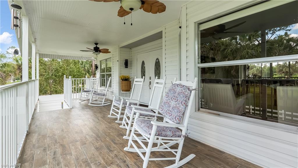 2920 24th Avenue Southeast Naples, FL 34117 - Photo 5 of 50 a dining room with furniture window and wooden floor