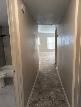 a view of a bathroom from a hallway