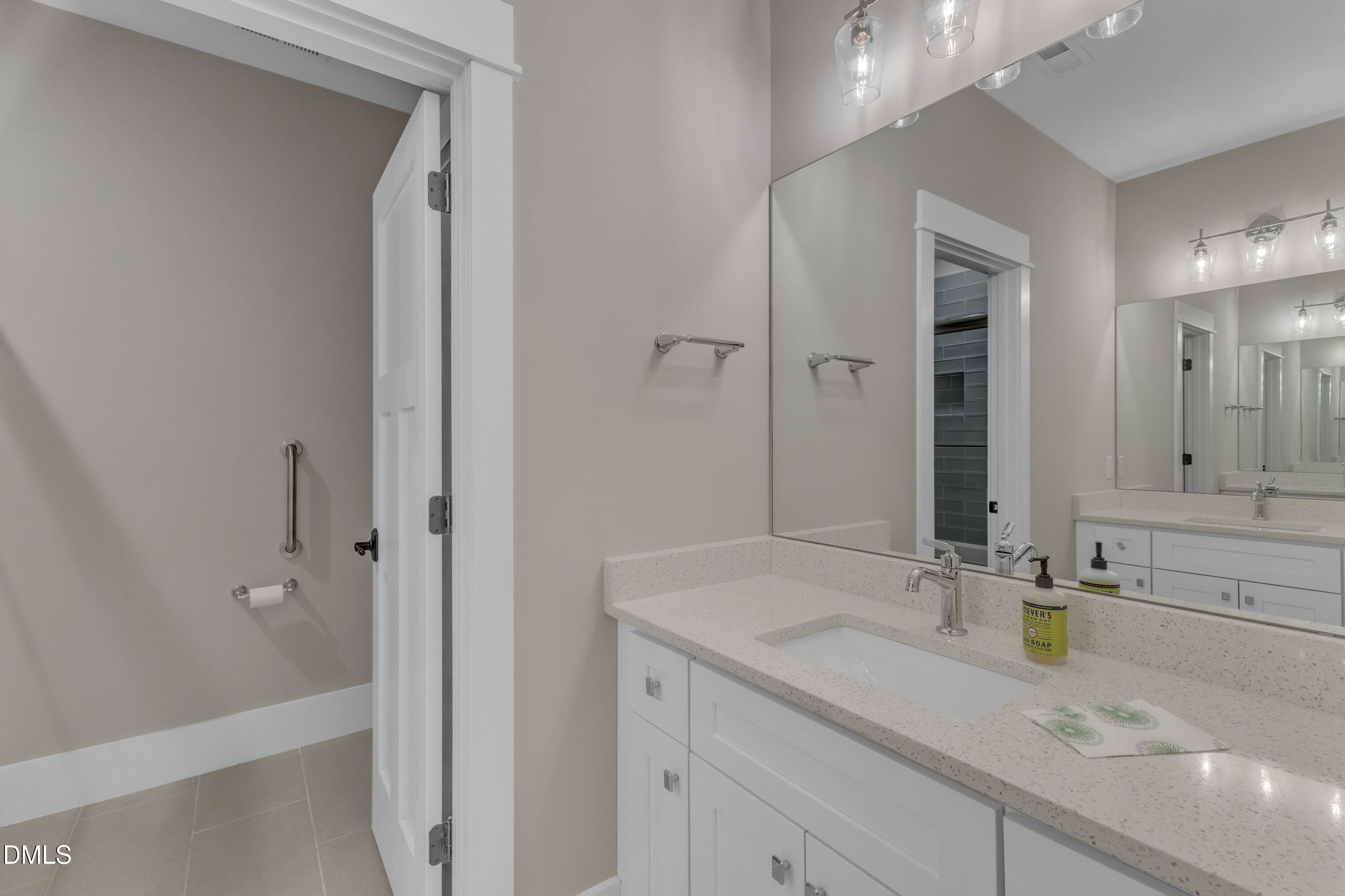 501 Hamilton Cottage Way Raleigh, NC 27605 - Photo 28 of 39 Upstairs Hall Bath w/Double Vanities