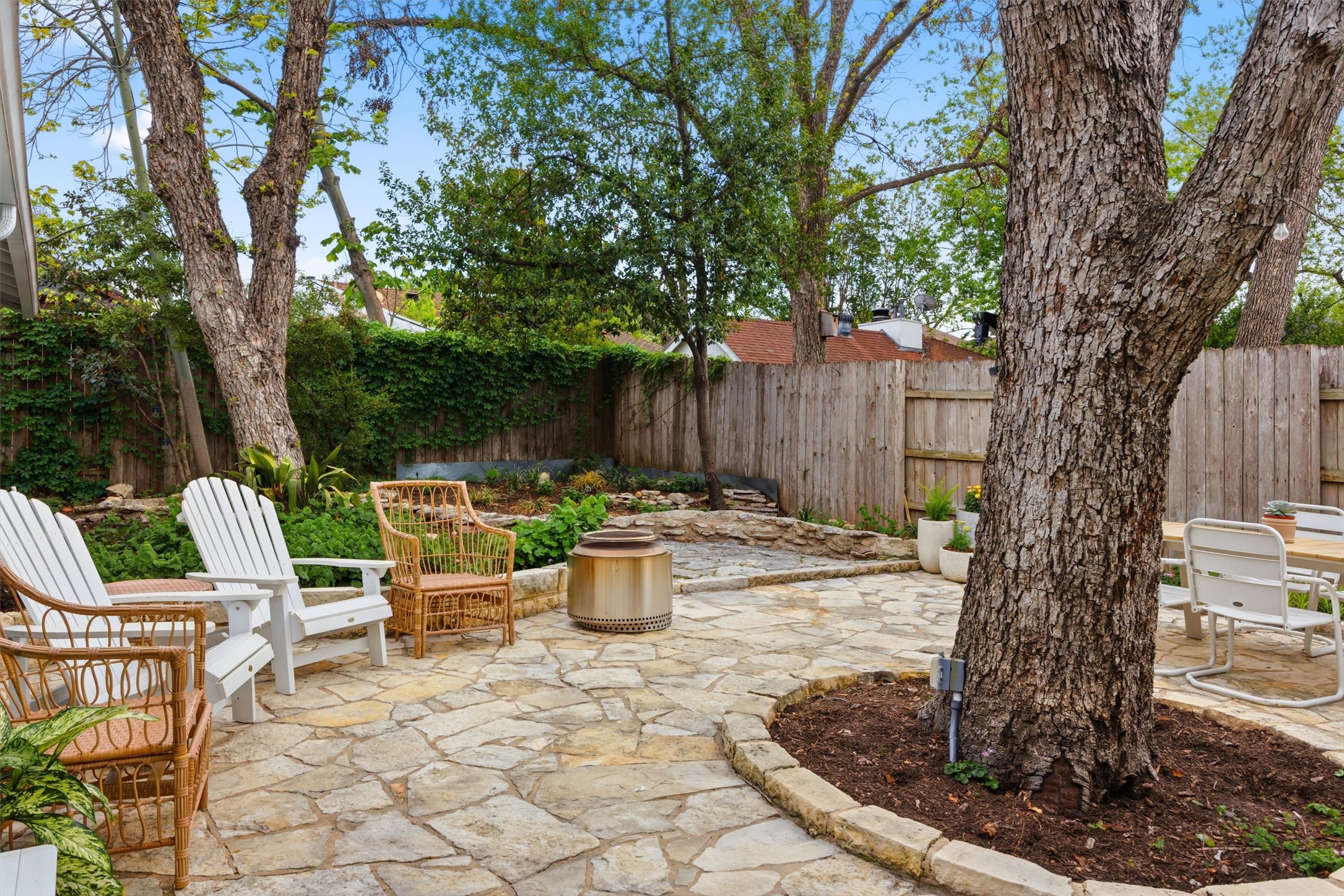 1507 Wethersfield Road Austin, TX 78703 - Photo 36 of 40 A flagstone patio provides an ideal setting for outdoor entertaining, surrounded by lush plantings.