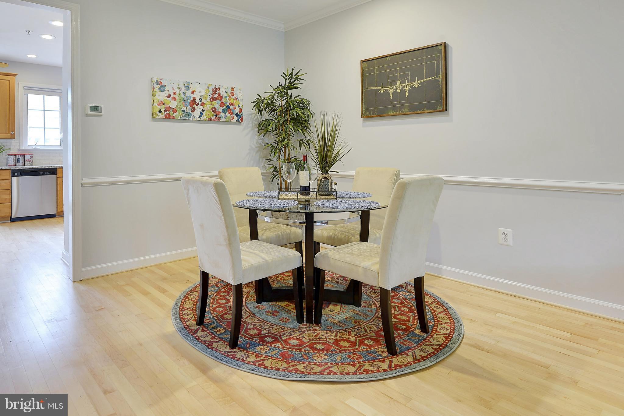 807 Capitol Square Place Southwest Washington, DC 20024 - Photo 7 of 30 a view of a dining room with furniture and wooden floor