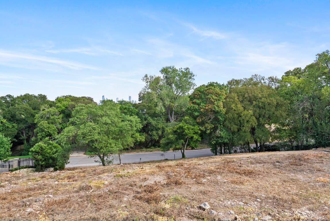 Undisclosed Address Austin, TX 78746 - Photo 12 of 15 a backyard of a house with large trees