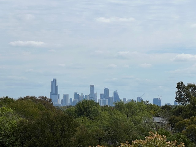 Undisclosed Address Austin, TX 78746 - Photo 13 of 15 a view of a city with tall buildings in the background
