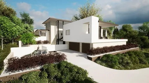 a front view of a house with a yard and lake view