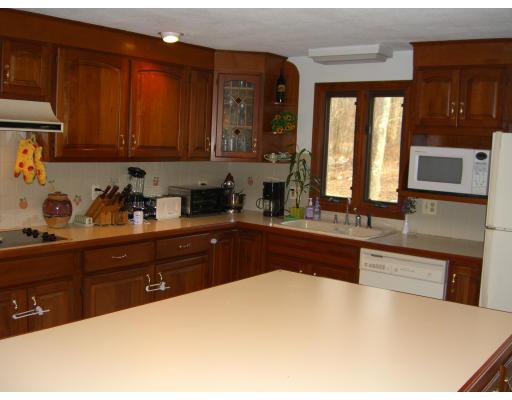 339 S Road Hampden, MA 01036 - Photo 2 of 17 a kitchen with stainless steel appliances wooden cabinets a sink and a stove