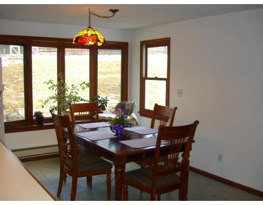 339 S Road Hampden, MA 01036 - Photo 3 of 17 a view of a dining room with furniture and a large window