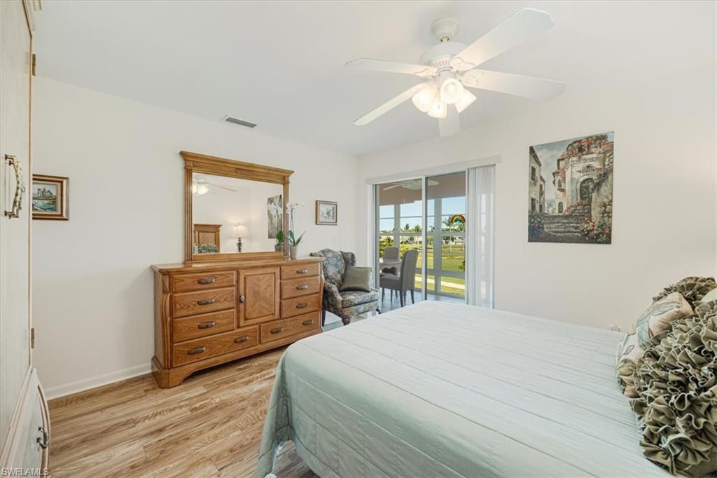 315 St Andrews Boulevard, Unit D37 Naples, FL 34113 - Photo 16 of 31 a bedroom with a bed and a dresser