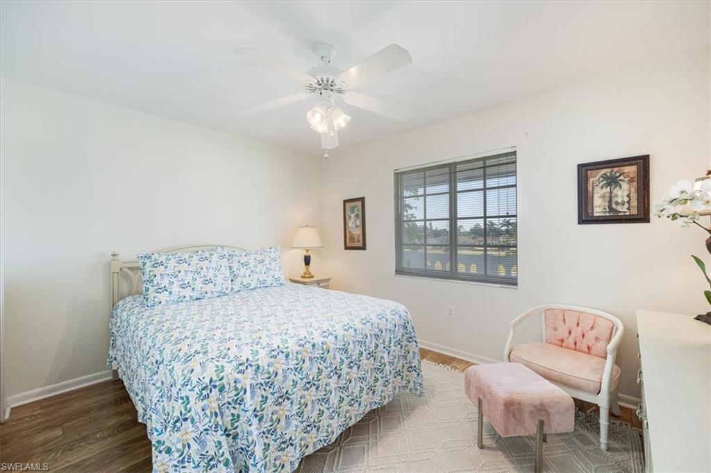 315 St Andrews Boulevard, Unit D37 Naples, FL 34113 - Photo 19 of 31 a bedroom with a bed and a couch