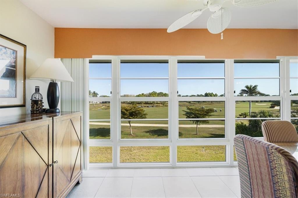315 St Andrews Boulevard, Unit D37 Naples, FL 34113 - Photo 21 of 31 a view of a bedroom with a large window