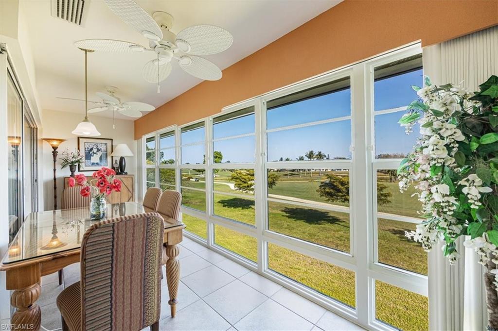 315 St Andrews Boulevard, Unit D37 Naples, FL 34113 - Photo 22 of 31 a view of a living room and a porch