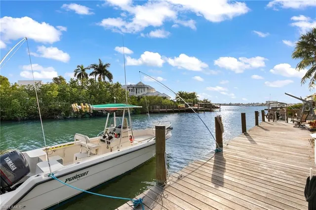 a view of a lake with a deck yard