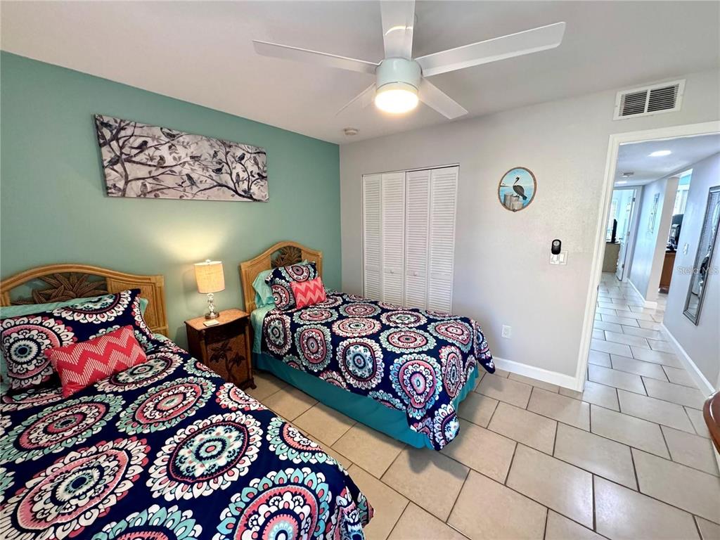 3473 Clark Road, Unit 171 Sarasota, FL 34231 - Photo 14 of 22 a bedroom with a bed and a couch