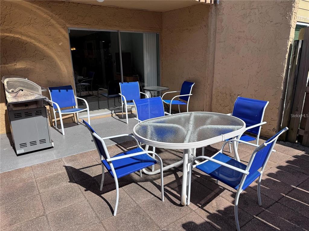 3473 Clark Road, Unit 171 Sarasota, FL 34231 - Photo 18 of 22 a dining room with furniture and wooden floor