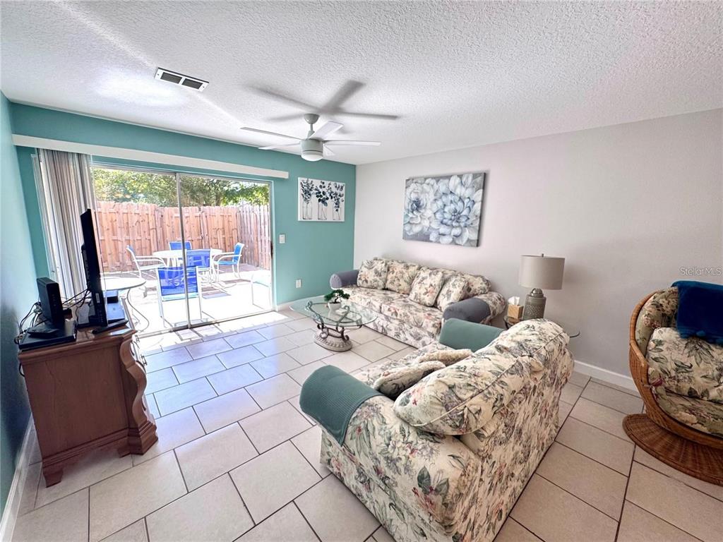 3473 Clark Road, Unit 171 Sarasota, FL 34231 - Photo 2 of 22 a living room with furniture and a flat screen tv