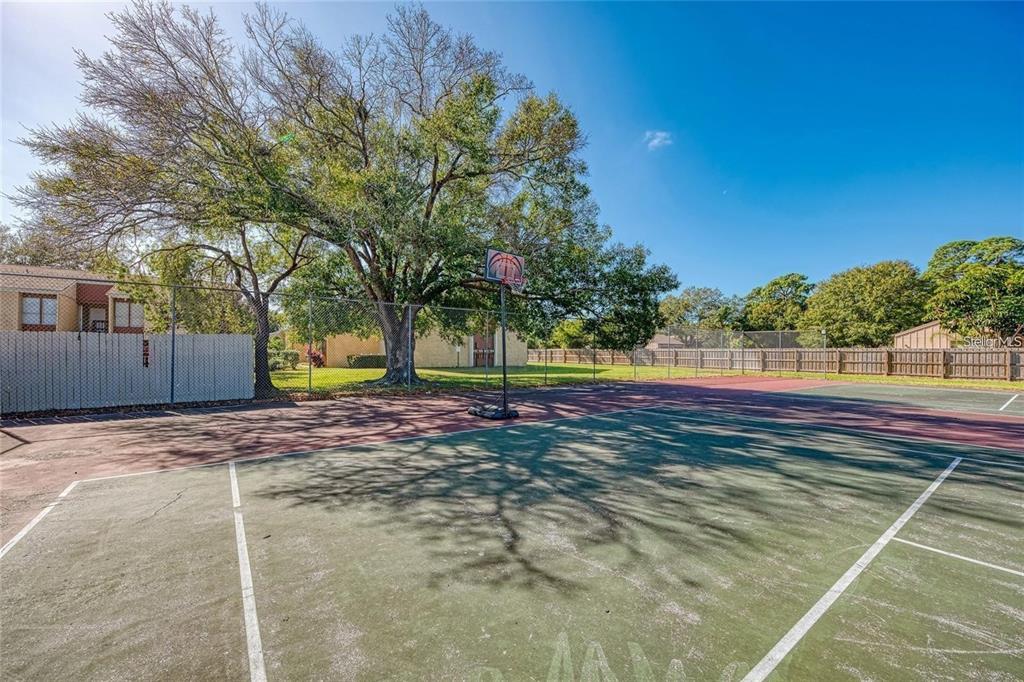3473 Clark Road, Unit 171 Sarasota, FL 34231 - Photo 22 of 22 a view of a yard with basketball court