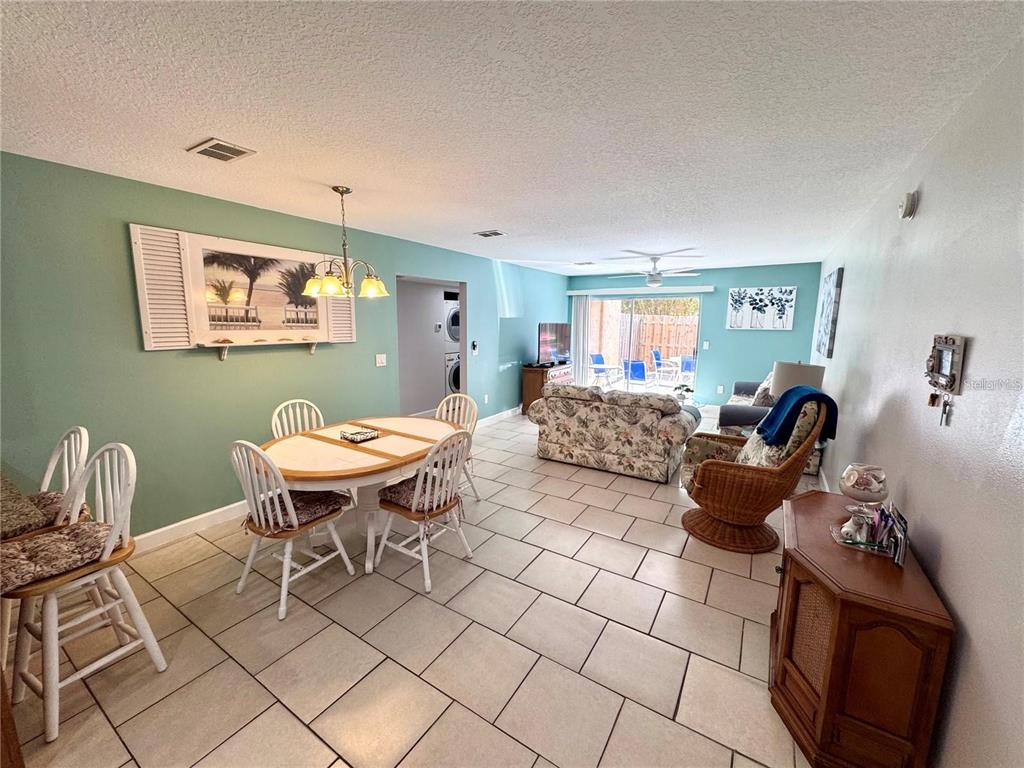 3473 Clark Road, Unit 171 Sarasota, FL 34231 - Photo 4 of 22 a living room with furniture a table and a window